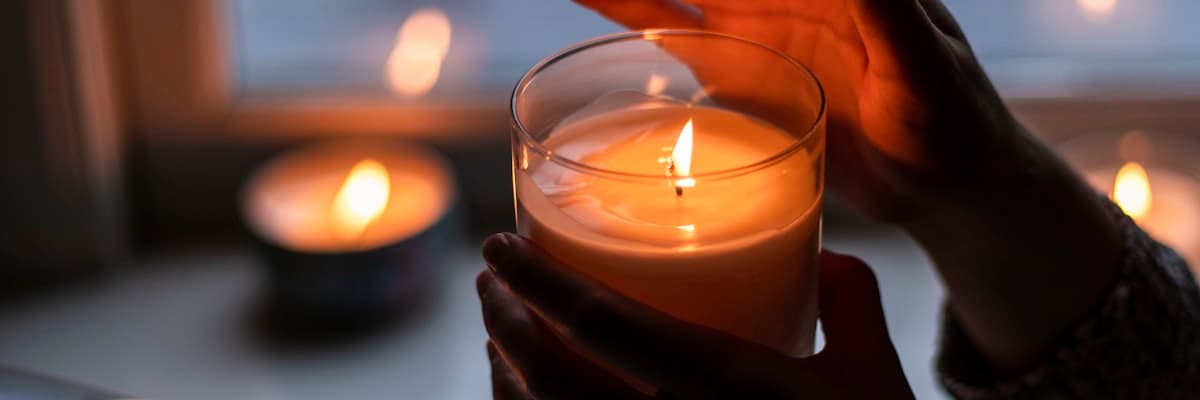 Handmade candles in a warm workshop setting